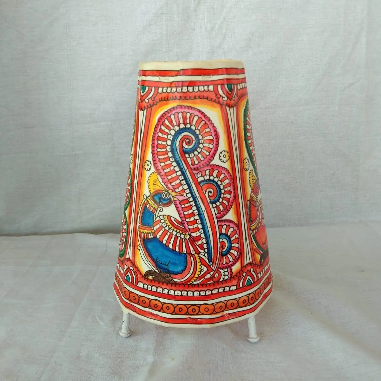 Handpainted colourful  table lamp.
Made of transparent leather.
Handcrafted alternative to a normal table lamp, upholding India’s heritage.